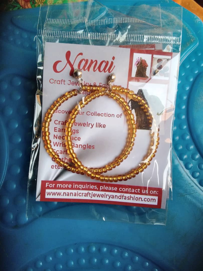 Gold-beaded hoop earrings